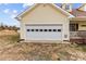 White garage door with multiple windows at 36190 Millingport Rd, New London, NC 28127