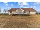 Back of house, featuring a deck and large yard at 36190 Millingport Rd, New London, NC 28127