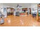 Open living space with hardwood floors and views into the kitchen and dining room at 36190 Millingport Rd, New London, NC 28127