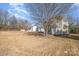 Spacious backyard with shed and neighboring houses visible at 3821 Bullard St, Charlotte, NC 28208