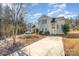 Two-story house with a driveway and mature trees at 3821 Bullard St, Charlotte, NC 28208