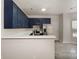 Kitchen with stainless steel appliances and blue cabinets at 3821 Bullard St, Charlotte, NC 28208