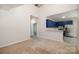 Modern kitchen featuring blue cabinets and a breakfast bar at 3821 Bullard St, Charlotte, NC 28208