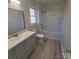 Bathroom with a bathtub and light gray vanity at 4066 Triton Dr, Fort Mill, SC 29708