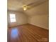 Bright bedroom with wood flooring and window at 4066 Triton Dr, Tega Cay, SC 29708