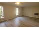 Bright bedroom featuring hardwood floors and large windows at 4066 Triton Dr, Tega Cay, SC 29708