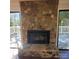 Stone fireplace with a hearth and a black firebox at 4066 Triton Dr, Tega Cay, SC 29708