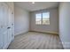 Bright bedroom with hardwood floors and window at 4827 Brookridge Ne Dr, Hickory, NC 28601