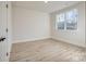 Simple bedroom with hardwood floors and a window at 4827 Brookridge Ne Dr, Hickory, NC 28601