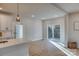 Sunlit dining area with sliding glass doors leading to a deck at 4827 Brookridge Ne Dr, Hickory, NC 28601