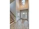 Two-story foyer with hardwood floors, a chandelier, and staircase at 4827 Brookridge Ne Dr, Hickory, NC 28601