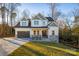 Two-story house with gray and white siding, stone accents, and a large front yard at 4827 Brookridge Ne Dr, Hickory, NC 28601