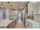 Modern kitchen with white cabinets, quartz countertops, and an island at 4827 Brookridge Ne Dr # 388, Hickory, NC 28601