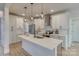 Modern kitchen with white cabinets, quartz countertops, and stainless steel appliances at 4827 Brookridge Ne Dr, Hickory, NC 28601