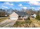 Single-story house with a yard, driveway, and detached shed at 489 Maple Ridge Cir, Salisbury, NC 28147