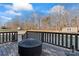 Back deck with fire pit and wooded backyard view at 489 Maple Ridge Cir, Salisbury, NC 28147