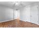 Bright bedroom with wood floors and double doors leading to a large closet at 489 Maple Ridge Cir, Salisbury, NC 28147