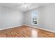 Simple bedroom with wood floors and a window at 489 Maple Ridge Cir, Salisbury, NC 28147