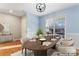 Virtually staged dining room with a wood table and chairs at 489 Maple Ridge Cir, Salisbury, NC 28147