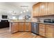 Open kitchen with stainless steel appliances and wood cabinets at 489 Maple Ridge Cir, Salisbury, NC 28147