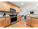 Kitchen with stainless steel appliances and wood cabinets at 489 Maple Ridge Cir, Salisbury, NC 28147