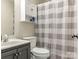 Bathroom featuring vanity with storage, toilet, and shower with patterned curtain at 5904 Bryant Ln, Waxhaw, NC 28173