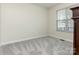 Neutral bedroom with a window, providing natural light and a spacious layout at 5904 Bryant Ln, Waxhaw, NC 28173