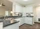 Bright kitchen featuring stainless steel appliances and tile flooring at 5904 Bryant Ln, Waxhaw, NC 28173