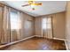 Bedroom with wood floors and patterned curtains at 604 E Louisiana Ave, Bessemer City, NC 28016