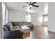 Living room with L-shaped sofa and hardwood floors at 604 E Louisiana Ave, Bessemer City, NC 28016