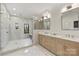 Luxurious bathroom with dual vanity, modern fixtures, and a glass-enclosed shower at 6133 Berryhill Towns Dr, Charlotte, NC 28270