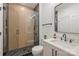 Modern bathroom featuring a glass-enclosed shower and a sleek vanity with a stylish mirror at 6133 Berryhill Towns Dr, Charlotte, NC 28270