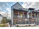 Multi-story home with brick facade, wooden porches and a wooden fence surround at 6133 Berryhill Towns Dr, Charlotte, NC 28270