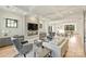 Spacious living room featuring a modern fireplace, coffered ceilings, and hardwood floors at 6133 Berryhill Towns Dr, Charlotte, NC 28270