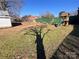 Large backyard with green space, complete with a playset and green fence providing a secure outdoor area at 7860 Georgia Ave, Kannapolis, NC 28081