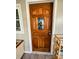 Inviting entryway with a decorative wooden front door and a glimpse of the cozy interior at 7860 Georgia Ave, Kannapolis, NC 28081