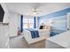 Bedroom with blue striped accent wall, guitar, curtained window, ceiling fan, and closet at 79031 Ridgehaven Rd, Lancaster, SC 29720