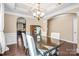 Elegant dining room featuring hardwood floors, a tray ceiling, and chandelier at 79031 Ridgehaven Rd, Lancaster, SC 29720