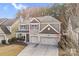 Charming two-story home featuring a two car garage, neutral colored exterior, and a cozy front porch at 79031 Ridgehaven Rd, Lancaster, SC 29720