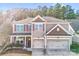 Charming two-story home featuring a two car garage, neutral colored exterior, and a cozy front porch at 79031 Ridgehaven Rd, Lancaster, SC 29720