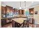 Modern kitchen with a granite island, stainless steel appliances, and custom tile backsplash at 79031 Ridgehaven Rd, Lancaster, SC 29720