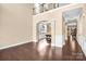 Bright living room featuring hardwood floors, and large windows with views into the dining room at 79031 Ridgehaven Rd, Lancaster, SC 29720