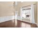 Bright living room featuring hardwood floors, high ceilings, and large windows with natural light at 79031 Ridgehaven Rd, Lancaster, SC 29720