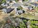 Aerial view showing the back yard, fence, pergola, and neighborhood at 849 Treva Anne Sw Dr, Concord, NC 28027