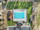 Overhead shot of a neighborhood pool featuring clearly marked lanes and a playground at 849 Treva Anne Sw Dr, Concord, NC 28027