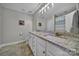 Bathroom with a granite countertop, double sinks, and a shower and tub combo at 849 Treva Anne Sw Dr, Concord, NC 28027