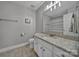 Updated bathroom features a granite countertop, white cabinets, and tile flooring at 849 Treva Anne Sw Dr, Concord, NC 28027