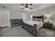 Bright bedroom featuring a rustic wood bedroom set and neutral walls at 849 Treva Anne Sw Dr, Concord, NC 28027