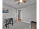 Neutral bedroom features a desk, ceiling fan, and a calming atmosphere at 849 Treva Anne Sw Dr, Concord, NC 28027