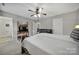 Cozy bedroom featuring a ceiling fan, a workspace and neutral walls at 849 Treva Anne Sw Dr, Concord, NC 28027